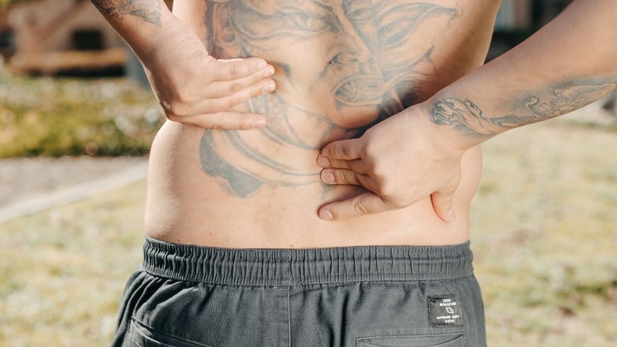 person with lower back and leg pain from sciatica